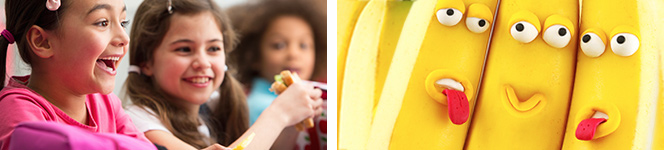 Kinder essen Pausenbrote und Bananen